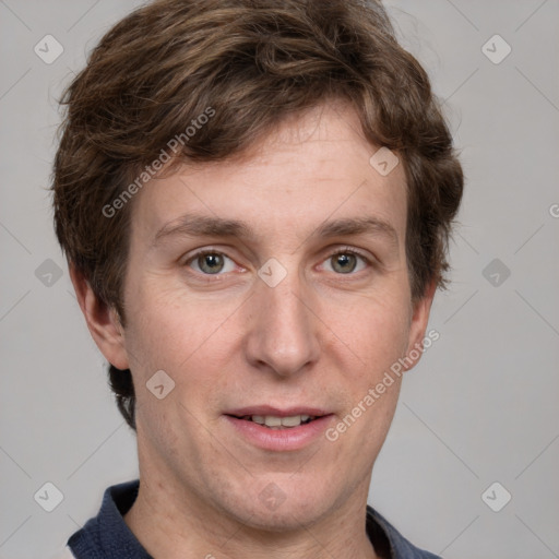 Joyful white adult male with short  brown hair and grey eyes