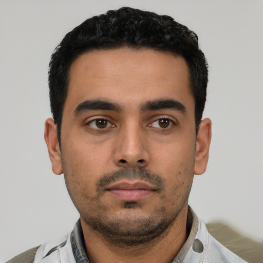 Neutral latino young-adult male with short  black hair and brown eyes