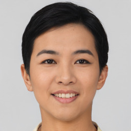 Joyful asian young-adult female with short  black hair and brown eyes