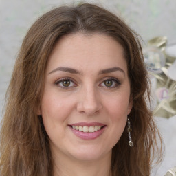 Joyful white young-adult female with medium  brown hair and green eyes