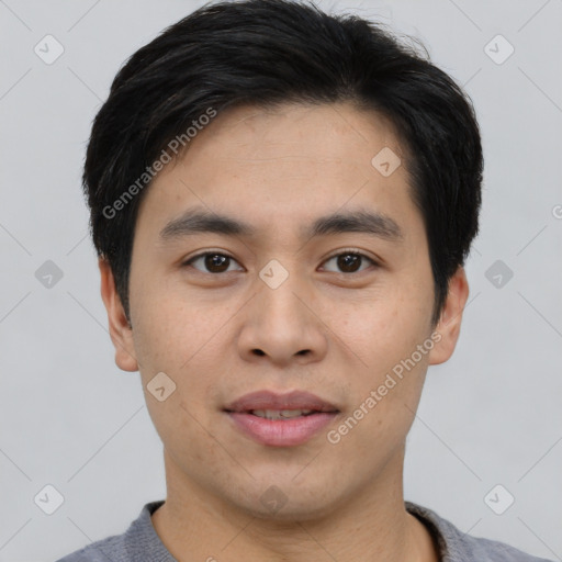 Joyful asian young-adult male with short  black hair and brown eyes