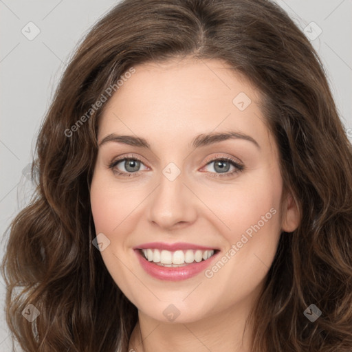 Joyful white young-adult female with long  brown hair and green eyes