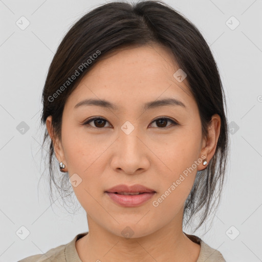 Joyful asian young-adult female with medium  brown hair and brown eyes