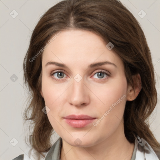 Joyful white young-adult female with medium  brown hair and green eyes