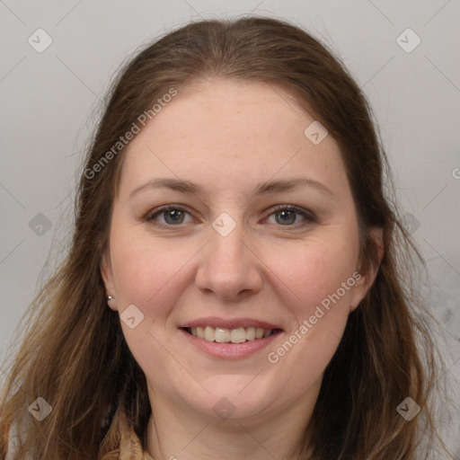 Joyful white young-adult female with long  brown hair and grey eyes