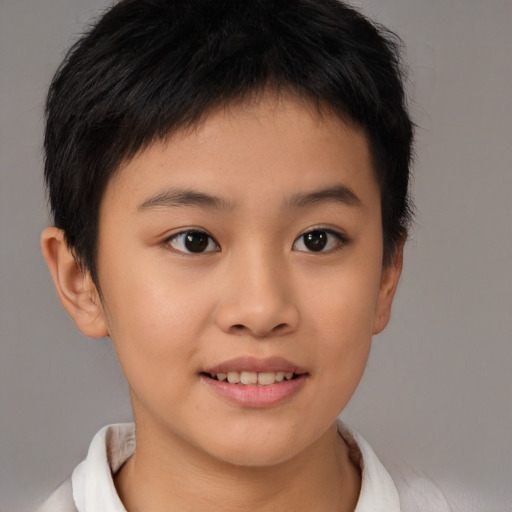Joyful asian child female with short  brown hair and brown eyes