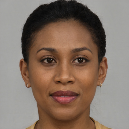 Joyful latino young-adult female with short  brown hair and brown eyes