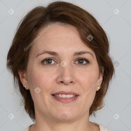 Joyful white adult female with medium  brown hair and brown eyes