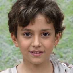 Joyful white child male with short  brown hair and brown eyes