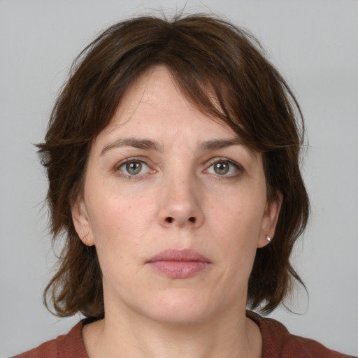 Neutral white young-adult female with medium  brown hair and grey eyes