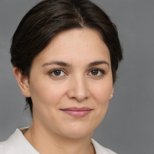 Joyful white young-adult female with medium  brown hair and brown eyes