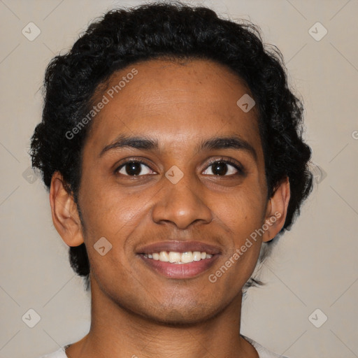 Joyful latino young-adult male with short  brown hair and brown eyes