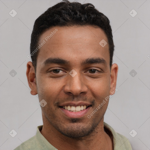 Joyful latino young-adult male with short  black hair and brown eyes