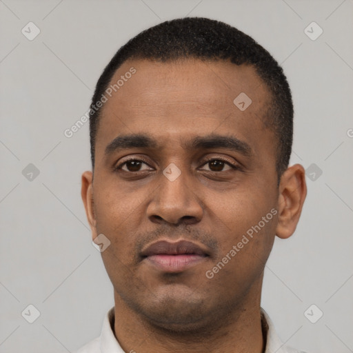 Neutral latino young-adult male with short  black hair and brown eyes