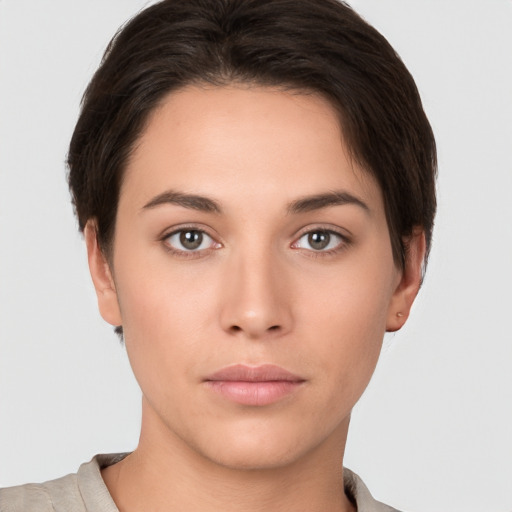 Neutral white young-adult female with short  brown hair and brown eyes