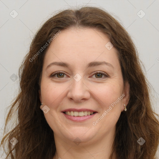 Joyful white adult female with long  brown hair and brown eyes