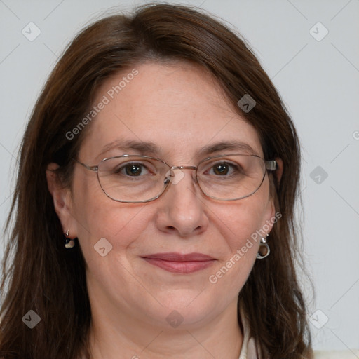 Joyful white adult female with long  brown hair and grey eyes