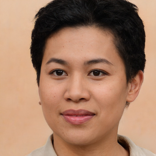 Joyful white young-adult female with short  brown hair and brown eyes