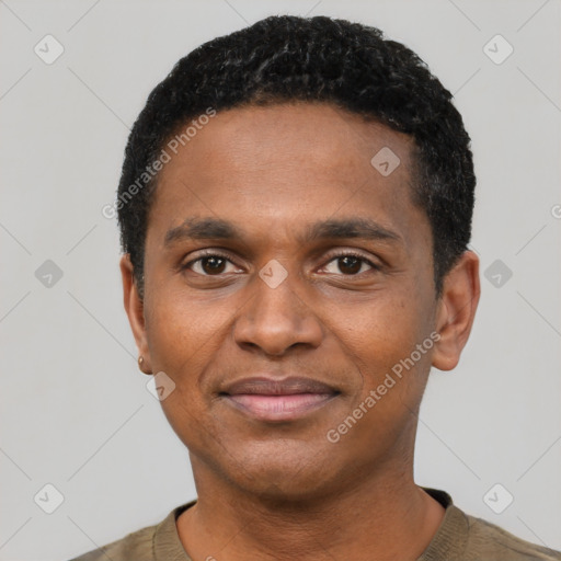 Joyful black young-adult male with short  black hair and brown eyes
