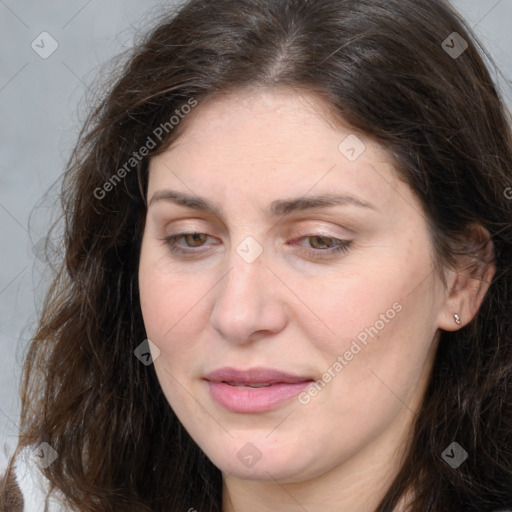 Joyful white adult female with long  brown hair and brown eyes