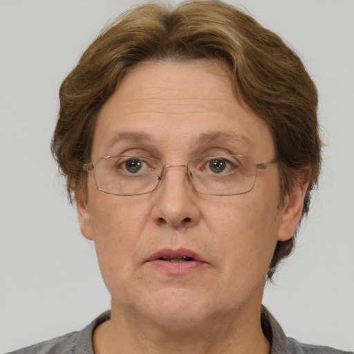 Neutral white middle-aged female with short  brown hair and brown eyes