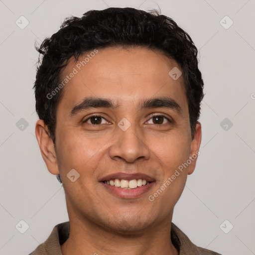 Joyful white young-adult male with short  black hair and brown eyes