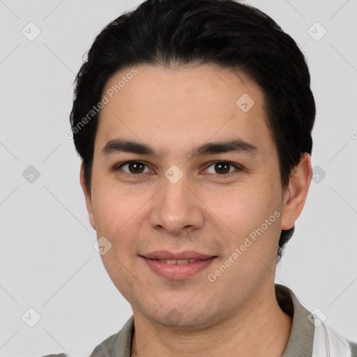 Joyful white young-adult male with short  black hair and brown eyes