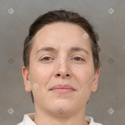 Joyful white adult female with short  brown hair and brown eyes