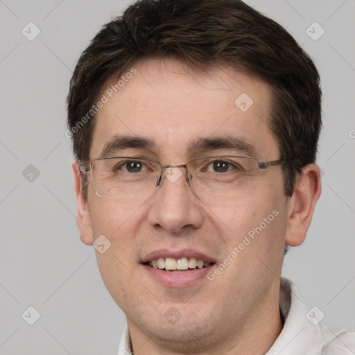 Joyful white adult male with short  brown hair and brown eyes