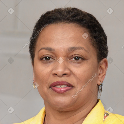 Joyful black adult female with short  brown hair and brown eyes