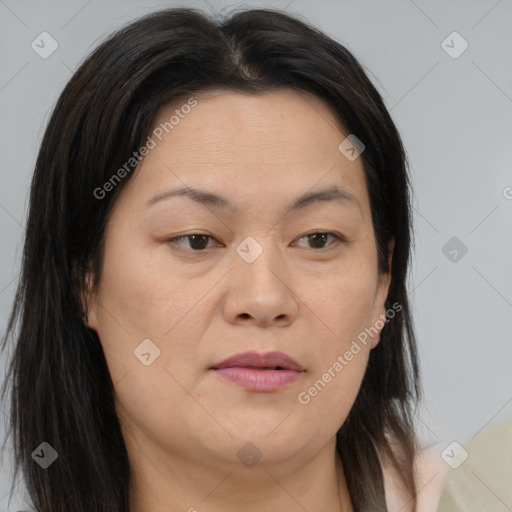 Joyful asian adult female with medium  brown hair and brown eyes