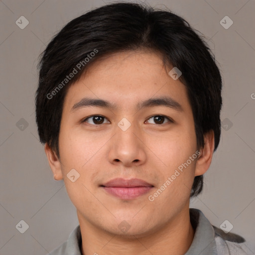 Joyful asian young-adult male with short  brown hair and brown eyes