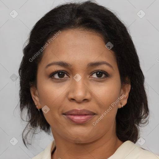 Joyful black adult female with medium  brown hair and brown eyes