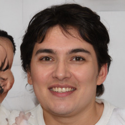 Joyful white young-adult male with medium  brown hair and brown eyes