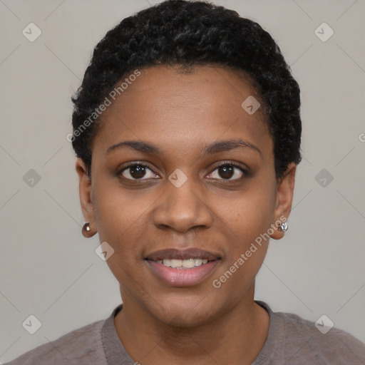 Joyful black young-adult female with short  black hair and brown eyes