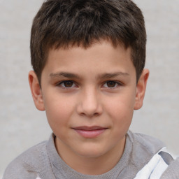 Joyful white child male with short  brown hair and brown eyes