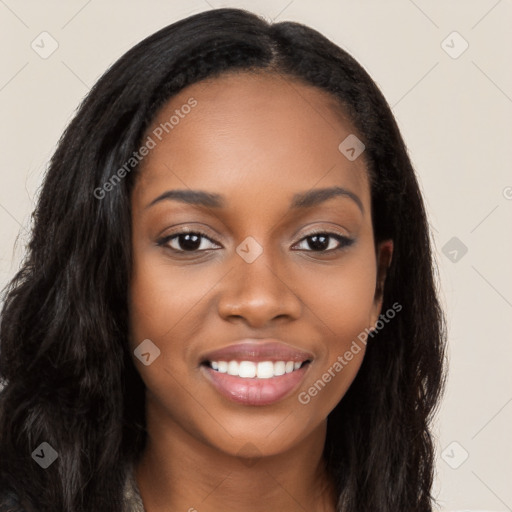 Joyful black young-adult female with long  brown hair and brown eyes