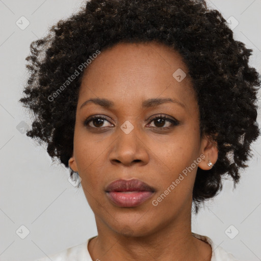 Neutral black adult female with short  black hair and brown eyes