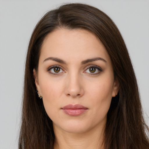 Neutral white young-adult female with long  brown hair and brown eyes