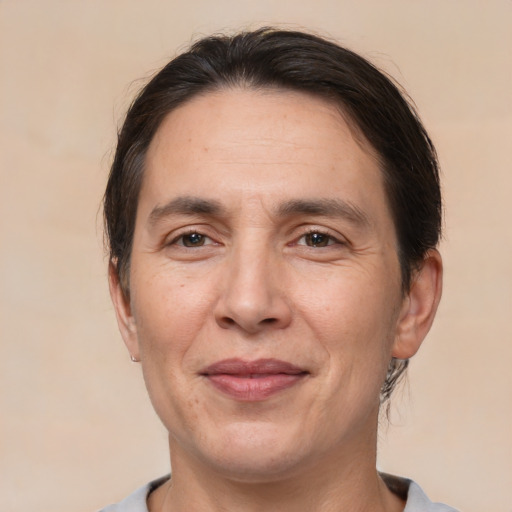 Joyful white adult male with medium  brown hair and brown eyes