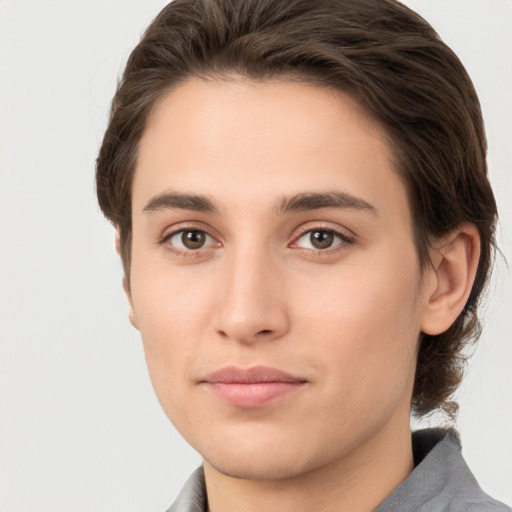 Joyful white young-adult male with medium  brown hair and brown eyes