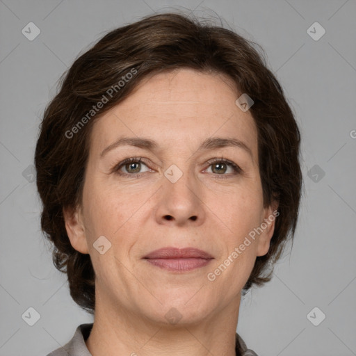 Joyful white adult female with medium  brown hair and grey eyes