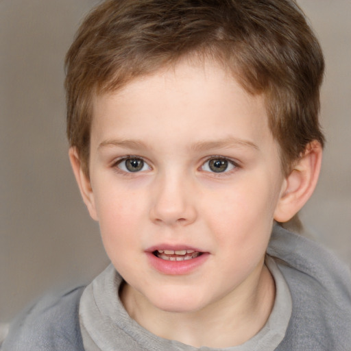 Joyful white child male with short  brown hair and brown eyes