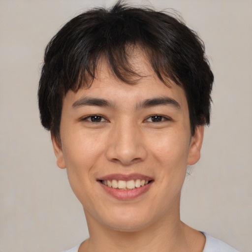 Joyful asian young-adult male with short  brown hair and brown eyes