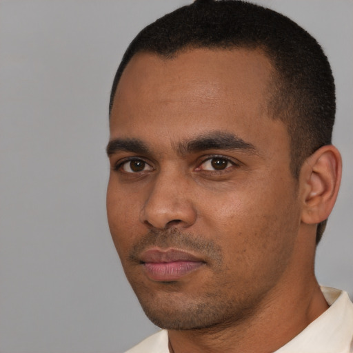 Neutral black young-adult male with short  brown hair and brown eyes