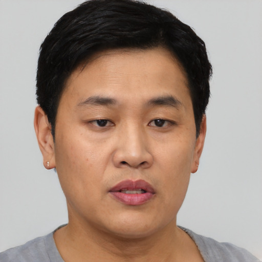 Neutral asian young-adult male with short  black hair and brown eyes
