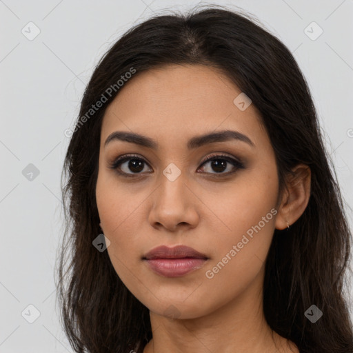 Neutral latino young-adult female with long  brown hair and brown eyes