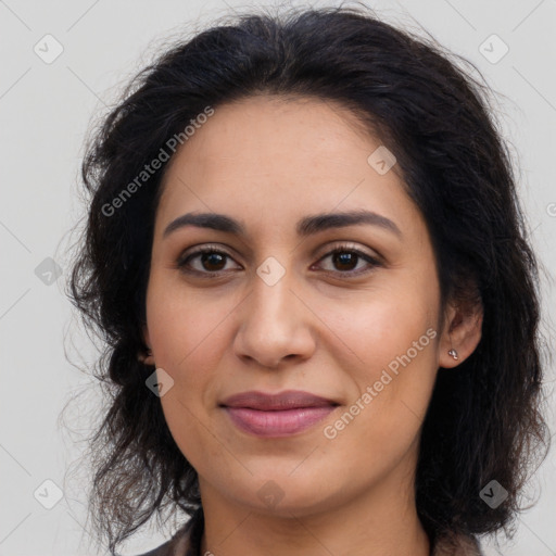 Joyful latino young-adult female with long  brown hair and brown eyes