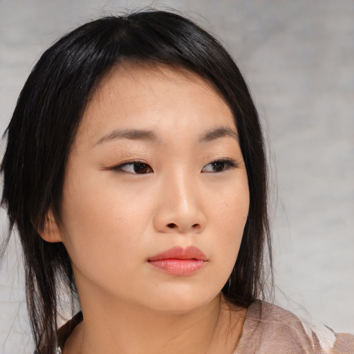 Neutral asian young-adult female with medium  brown hair and brown eyes