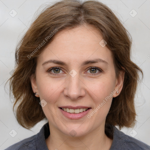 Joyful white adult female with medium  brown hair and grey eyes